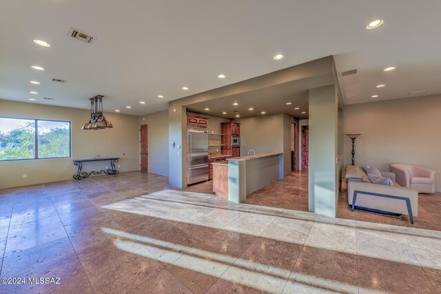full bath featuring vanity, a shower stall, and visible vents