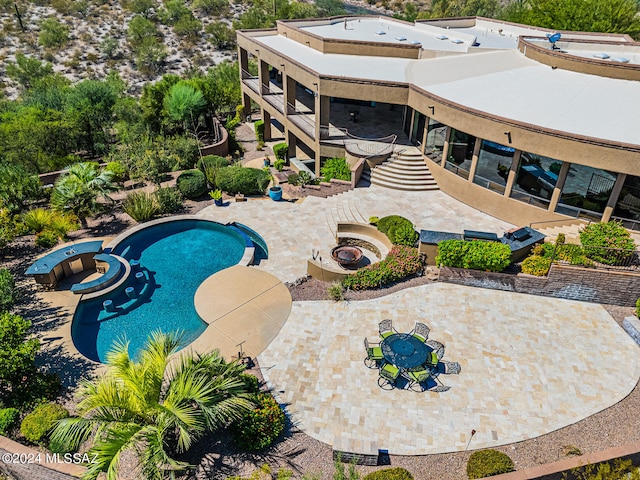 view of swimming pool featuring a patio area