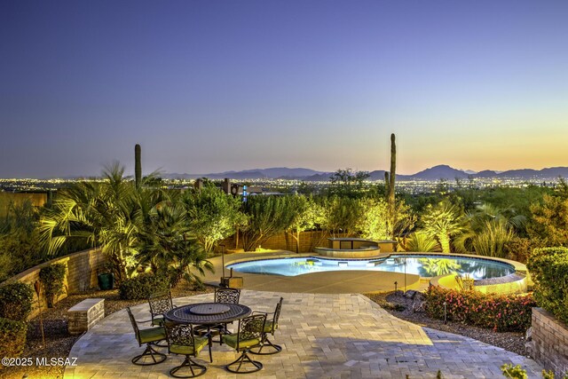 pool featuring stairway and a patio area