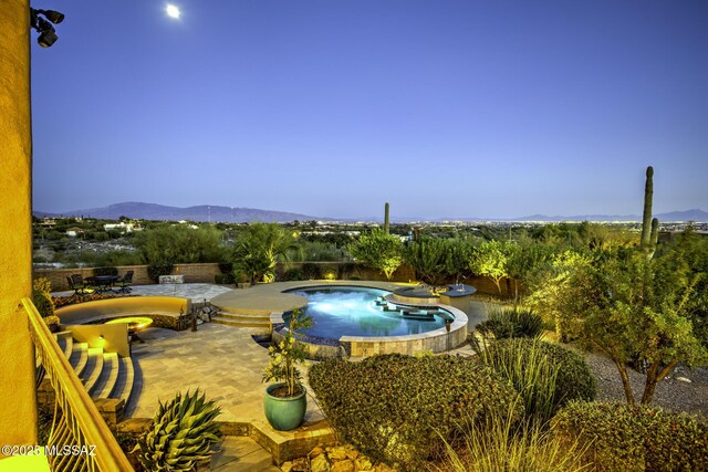 patio terrace at dusk featuring outdoor dining area
