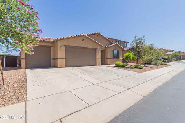 mediterranean / spanish-style house featuring a garage