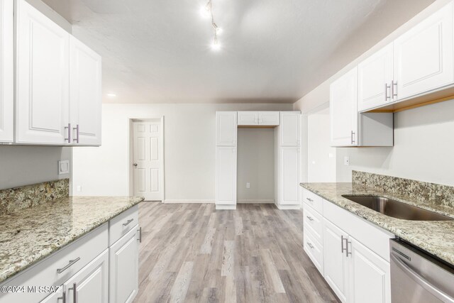 kitchen with dishwasher and white cabinets