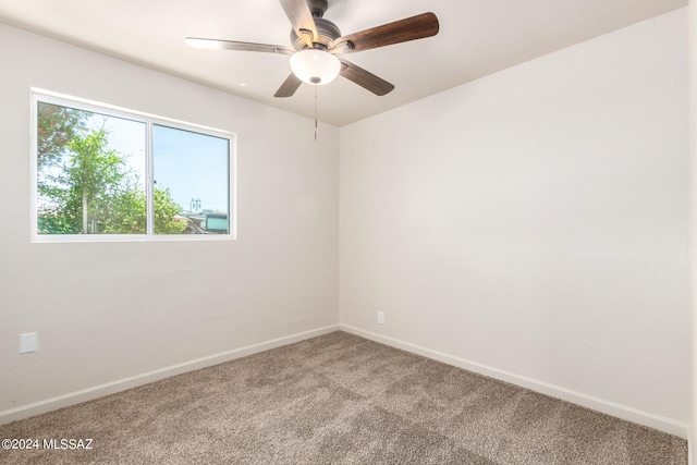 unfurnished room with light carpet and ceiling fan