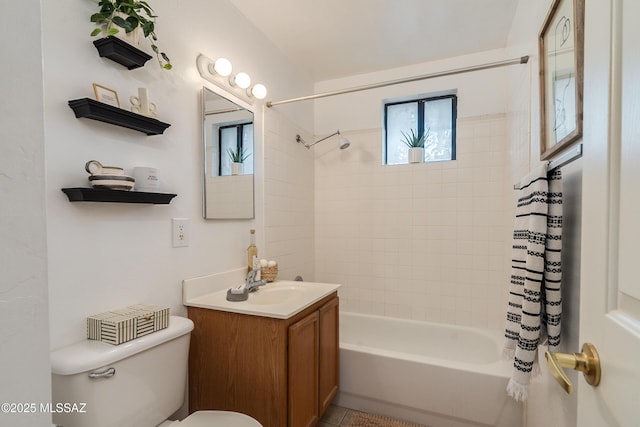 full bathroom featuring shower / tub combo with curtain, vanity, and toilet