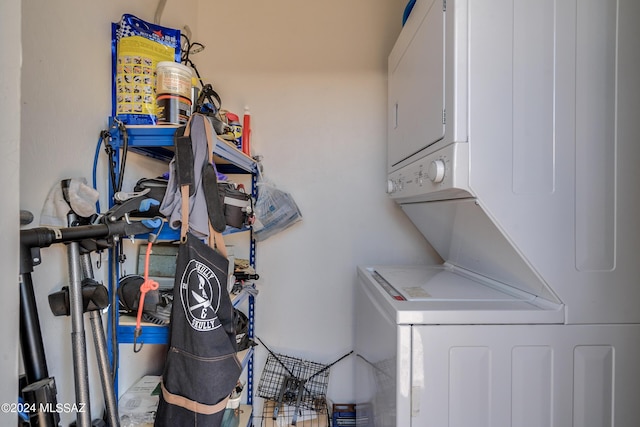 washroom with stacked washer and clothes dryer