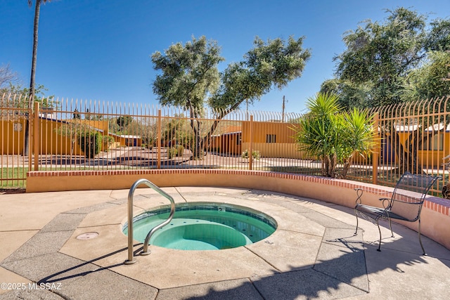 view of swimming pool with an in ground hot tub