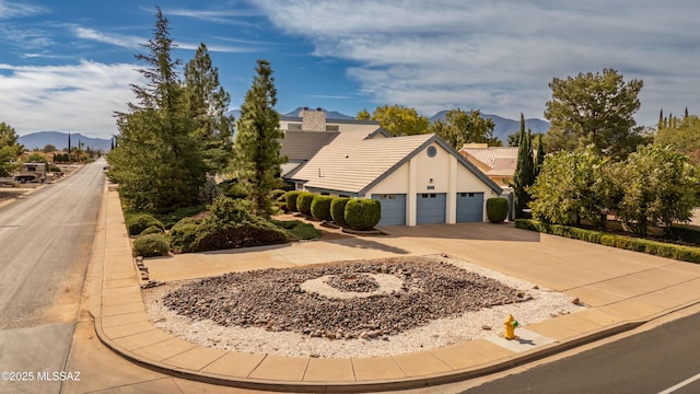 exterior space with a mountain view and a garage