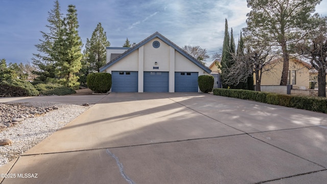 view of side of home featuring a garage