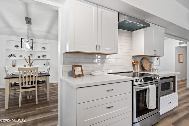 kitchen with wall chimney exhaust hood, dark wood-type flooring, white cabinets, and stainless steel appliances