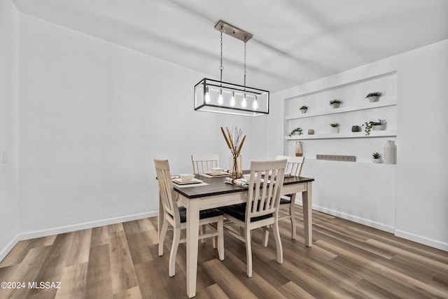 dining area with hardwood / wood-style flooring