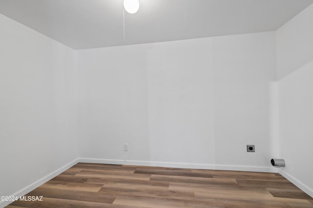 unfurnished room featuring dark hardwood / wood-style flooring