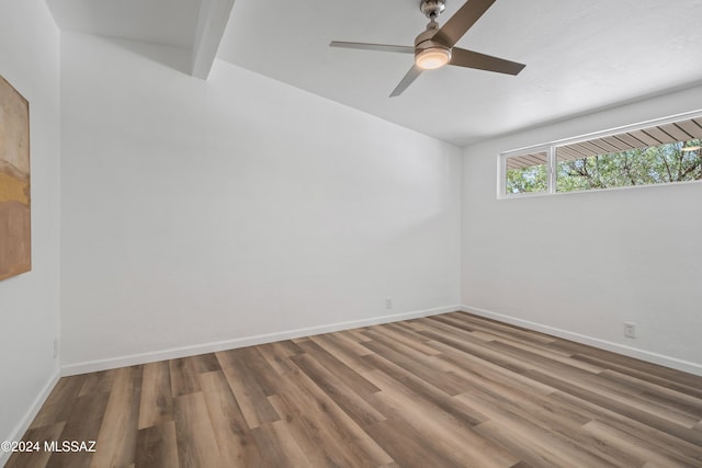 empty room featuring hardwood / wood-style floors and ceiling fan