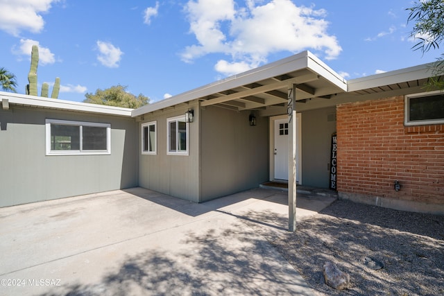 rear view of house featuring a patio area