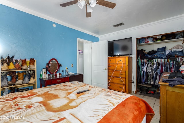 bedroom with ceiling fan and a closet