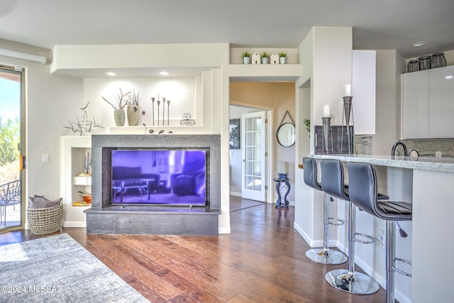 living room with dark hardwood / wood-style floors