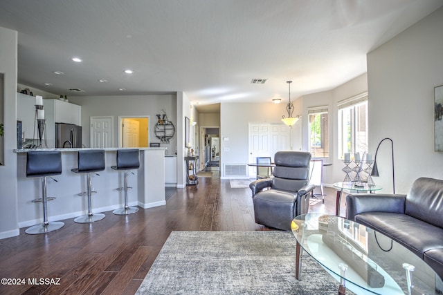 living room featuring dark hardwood / wood-style flooring