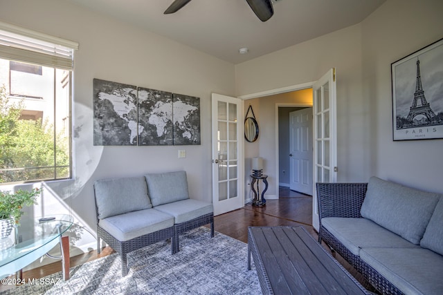 living room featuring dark wood-type flooring, french doors, and ceiling fan