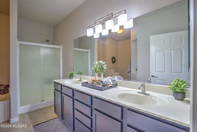 bathroom featuring walk in shower, tile patterned flooring, and vanity