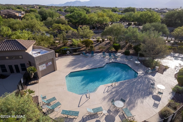 view of swimming pool with a patio