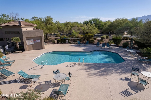 view of swimming pool featuring a patio