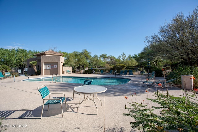 view of pool featuring a patio