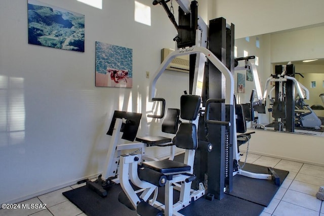 workout area with light tile patterned floors