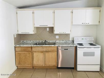 kitchen featuring light tile patterned floors, light countertops, white electric range oven, stainless steel dishwasher, and a sink