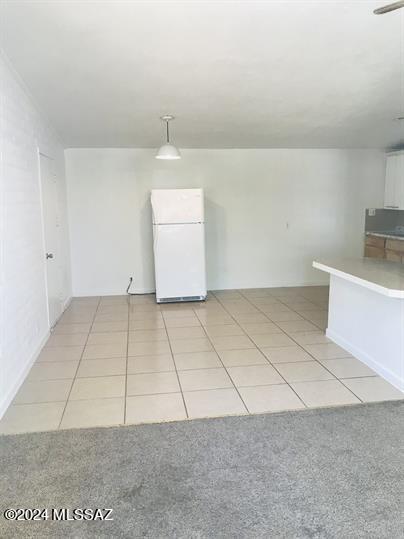 interior space featuring light tile patterned floors