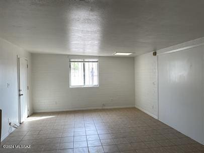 empty room featuring tile patterned floors