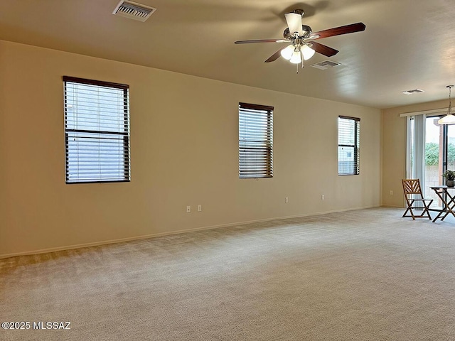 carpeted empty room with ceiling fan