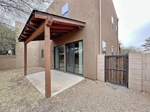 rear view of house featuring a patio area