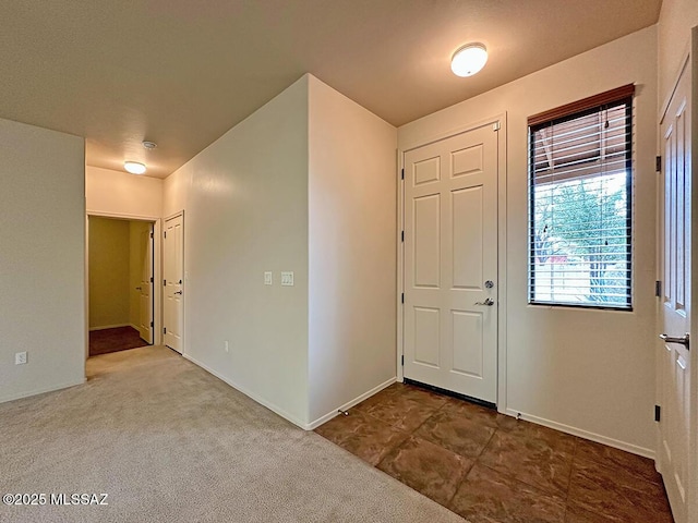 entrance foyer with carpet floors