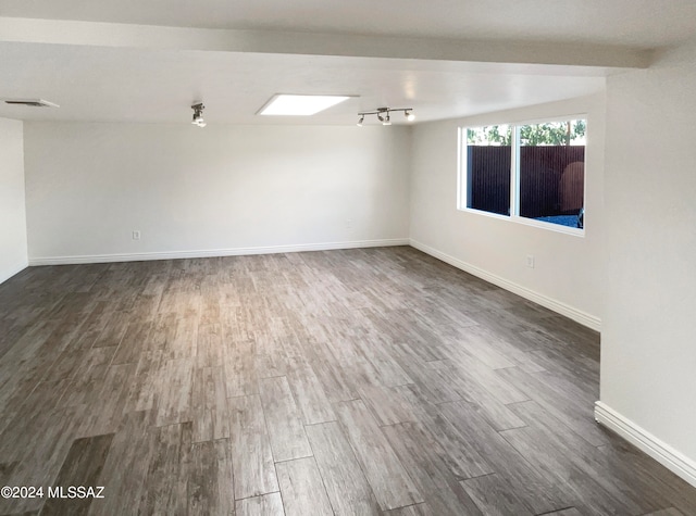 unfurnished room featuring dark hardwood / wood-style floors