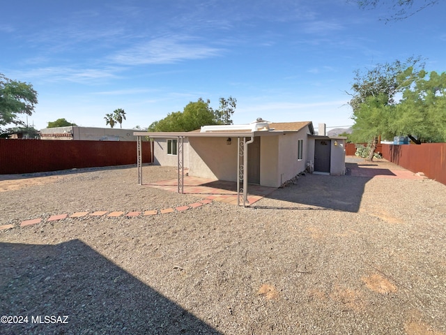 back of house with a patio area