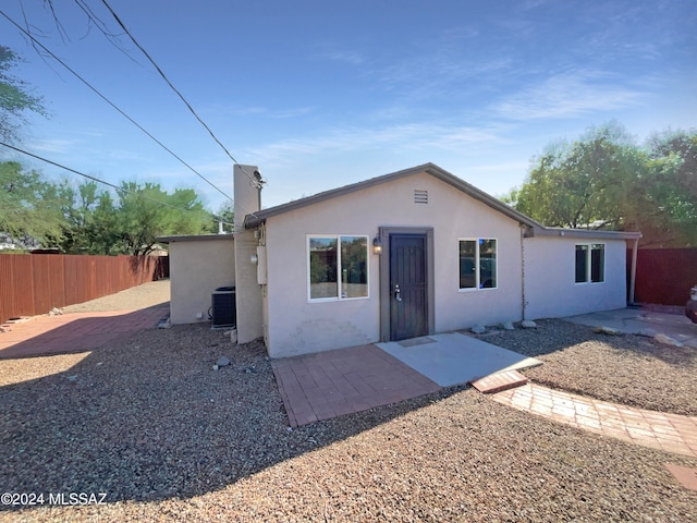 view of front of home featuring a patio area and central air condition unit