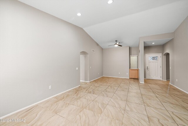 foyer featuring ceiling fan and lofted ceiling