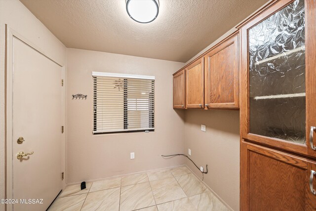 kitchen with light stone counters, sink, kitchen peninsula, and stainless steel dishwasher