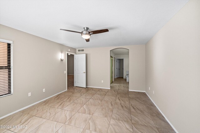 unfurnished room featuring ceiling fan, a textured ceiling, and light tile patterned floors