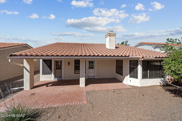 back of property with a patio and central air condition unit