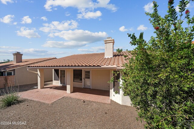 back of house with a patio area