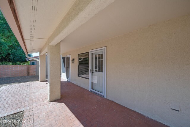 rear view of house featuring a patio