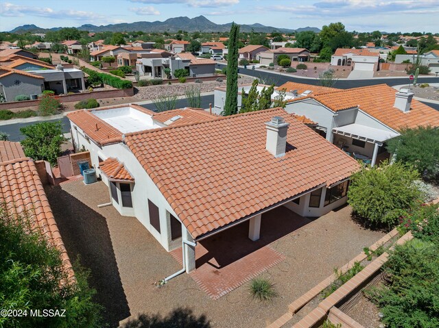 birds eye view of property with a mountain view