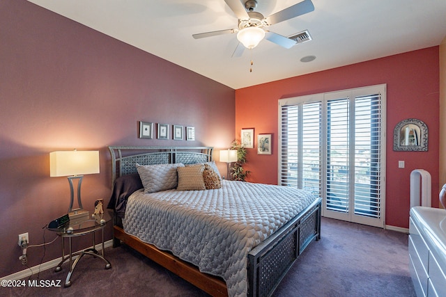 bedroom featuring access to exterior, dark colored carpet, and ceiling fan