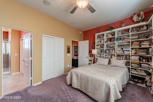 carpeted bedroom with a closet and ceiling fan