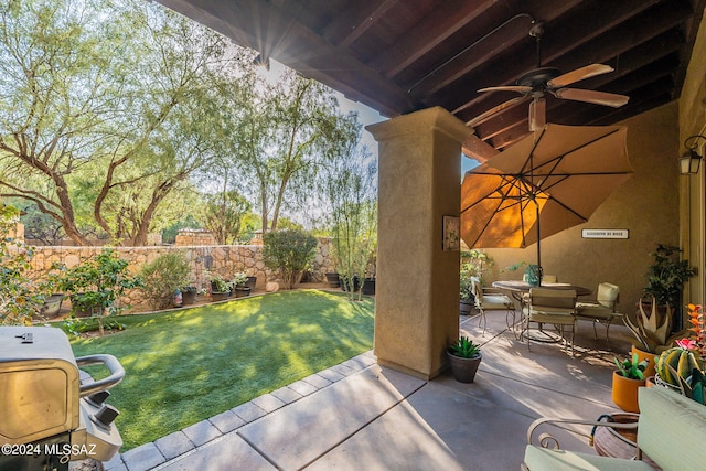 view of patio featuring ceiling fan