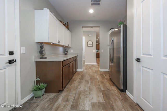 9745 S Desert Flint Dr, Tucson, AZ 85747 - hall featuring baseboards, light wood-style floors, visible vents, and recessed lighting