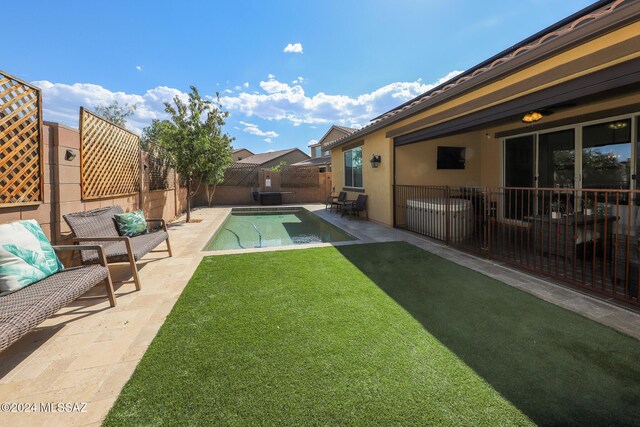 9745 S Desert Flint Dr, Tucson, AZ 85747 - view of pool featuring a yard, a patio area, a fenced in pool, and a fenced backyard
