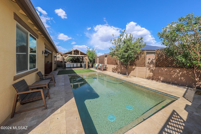9745 S Desert Flint Dr, Tucson, AZ 85747 - view of swimming pool featuring a fenced in pool, a fenced backyard, a gazebo, a patio area, and an outdoor living space