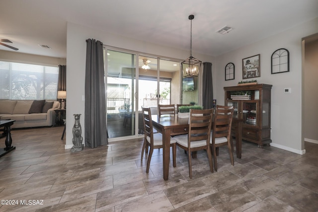 9745 S Desert Flint Dr, Tucson, AZ 85747 - dining area with a healthy amount of sunlight, visible vents, and ceiling fan with notable chandelier