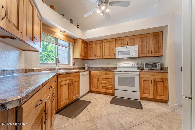 kitchen with white appliances, light tile patterned flooring, sink, and ceiling fan